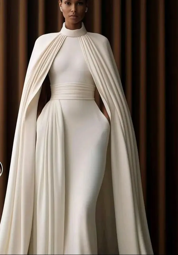 femme avec longue robe blanche et longue cape